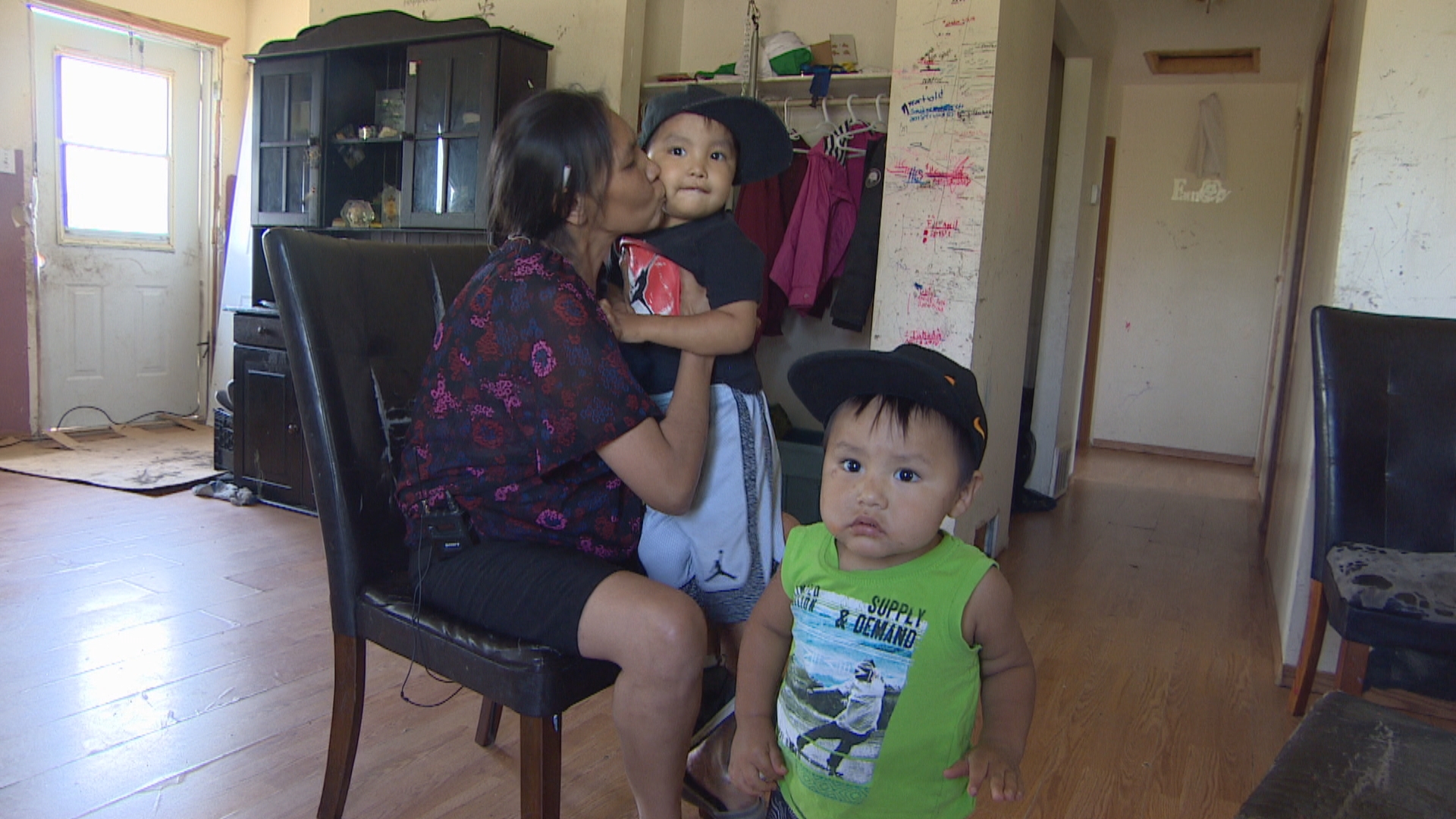 From her home on the Onion Lake Cree Nation, Charmaine Stick (seen here with two of her grandchildren) has been pushing the band council to release financial documents for years. (CBC)