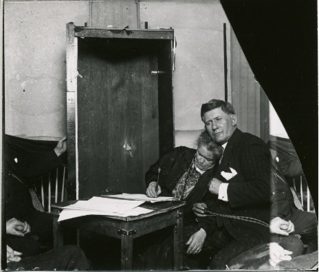 T.G. Hamilton sits with the family's nanny and earliest medium, Elizabeth Poole, while she is in a trance.