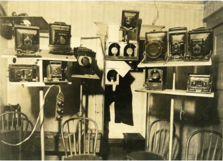 A battery of cameras covers one wall of the seance room in T.G. Hamilton's home.