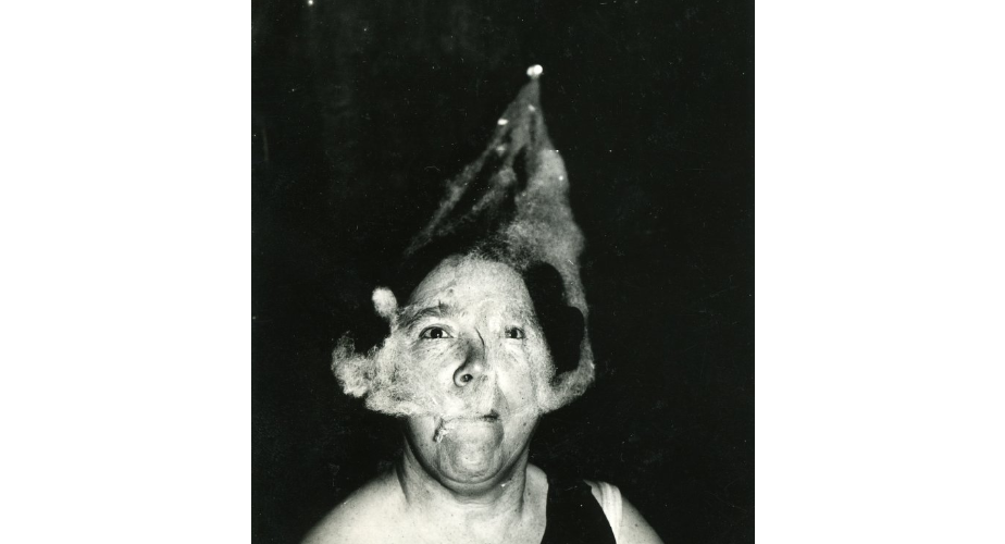 Ectoplasm forms on the face of medium Mary Marshall during a seance at T.G. Hamilton's home.