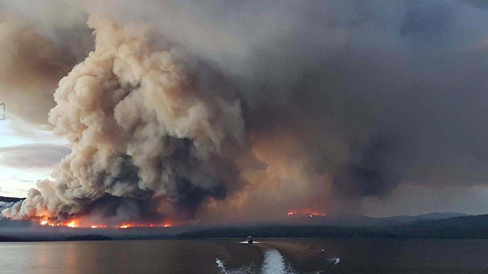 A wildfire burns across the lake from the Pondosy Bay Wilderness Resort near Tweedsmuir in the summer of 2018. (Pondosy Bay Wilderness Resort)