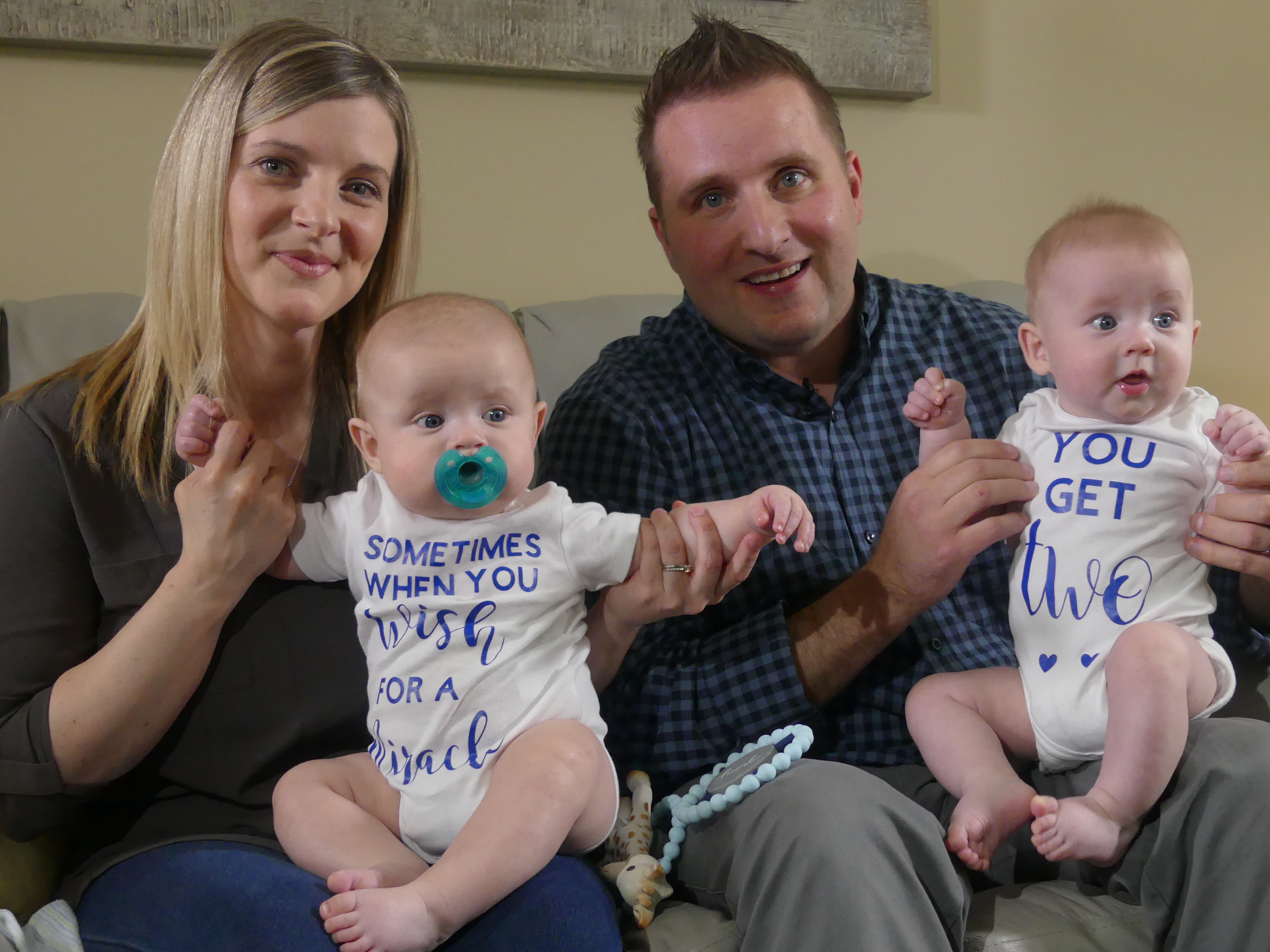 Jennifer and Cory Mitchell are overjoyed with their twin boys, Austin, left, and Clarke, right. (Ariana Kelland/CBC)