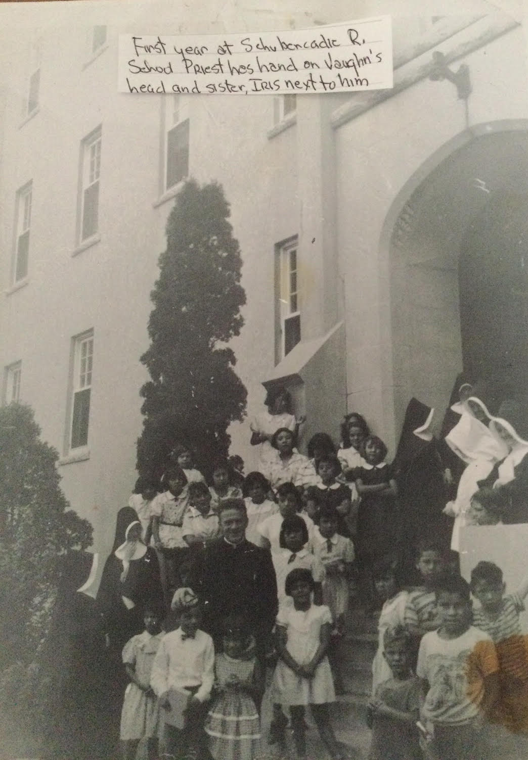 In this picture of Vaughn Nicholas during his first year at Shubenacadie, the school priest has his hand on Nicholas’s head. (Submitted by Vaughn Nicholas)