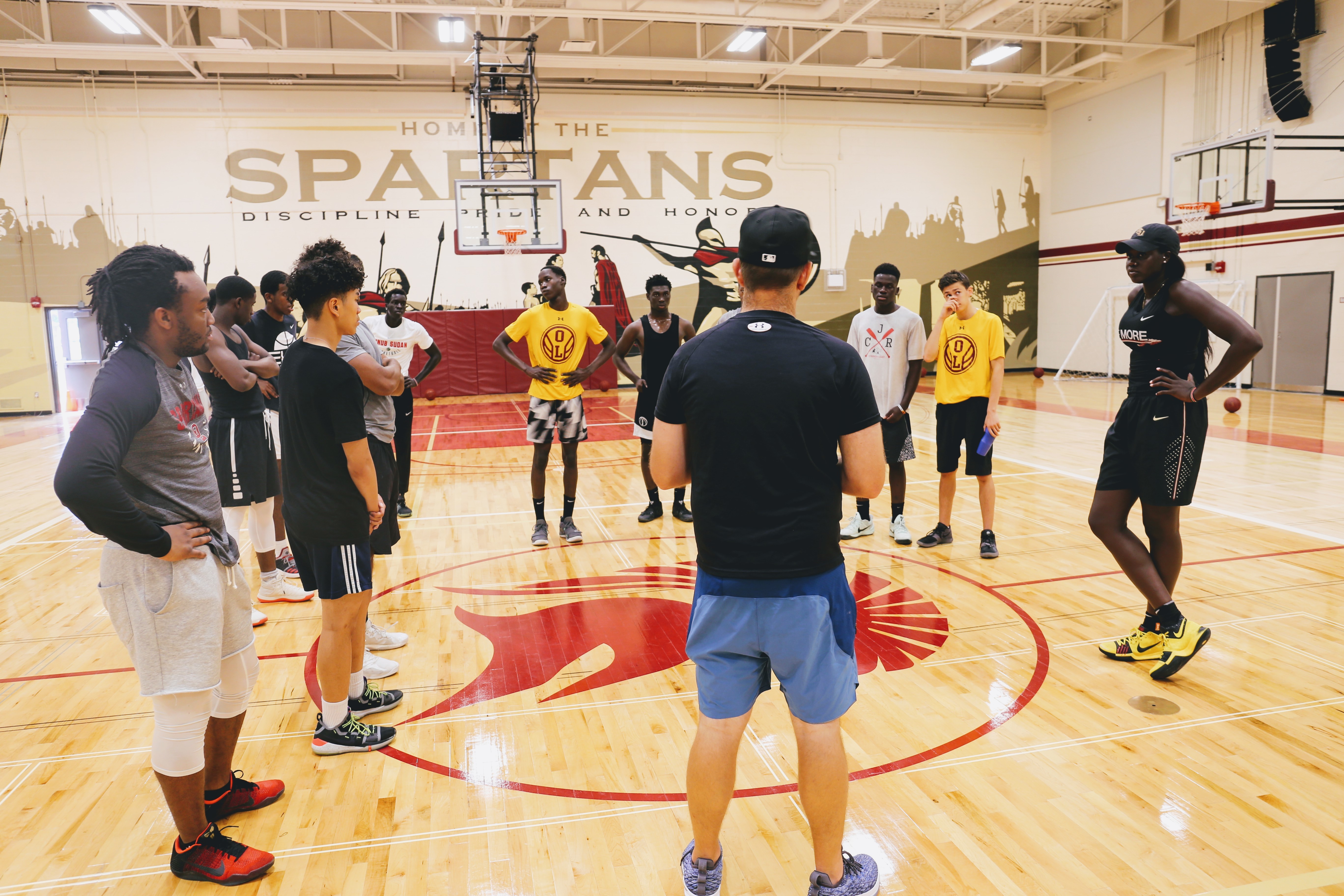 Bulgak speaks with a group of young men who were shooting hoops at Archbishop O'Leary High School.