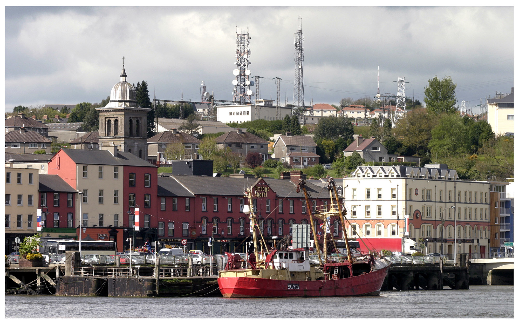 Fishing vessels and small businesses are part of the cityspace at the waterfront. 