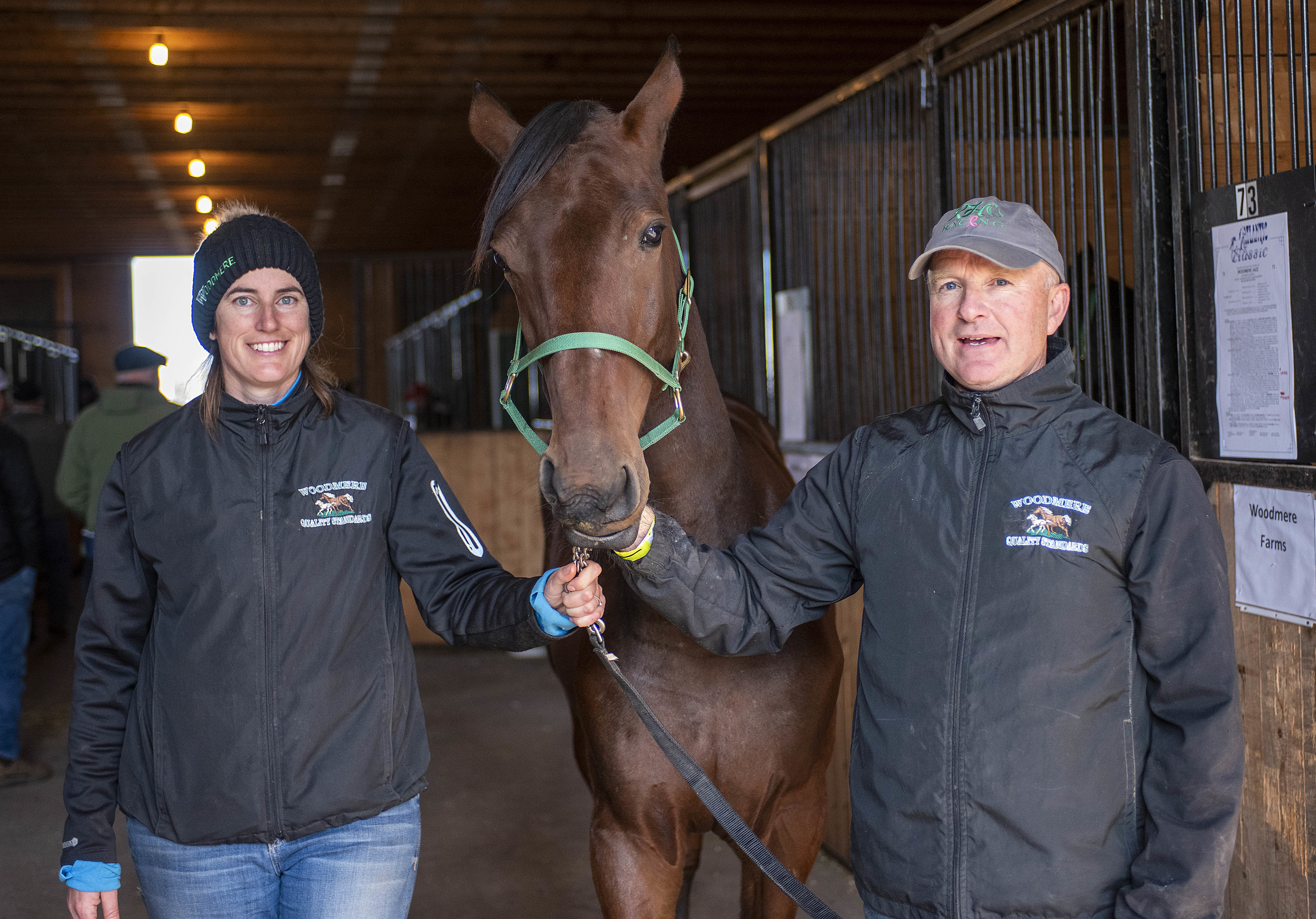 Bronwyn Crane and Bruce Wood, co-owners of Woodmere Farms in Marshfield, hold Woodmere Androlli that sold for $26,000. It was a good day for the farm. They sold seven horses with Woodmere Sheldon bringing $34,000. The average price for each horse was $24,714. (Brian McInnis/CBC)