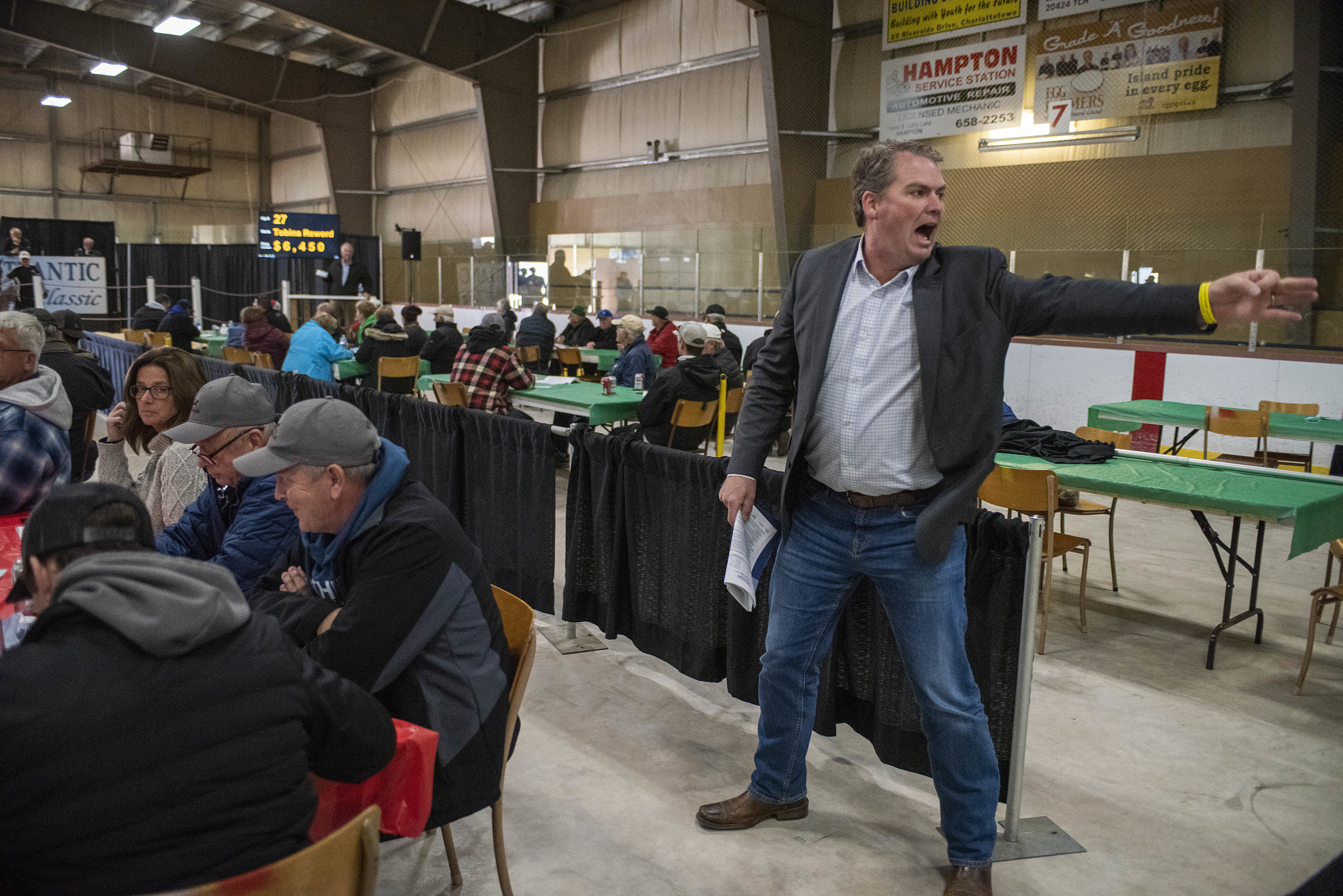 Before Bloyce Thompson became P.E.I.’s minister of agriculture, he worked selling cattle and horses, so he’s comfortable in the auction ring and working as a bid taker. He was at the sale Friday because a longtime friend who works the auctions was ill. Thompson said a bid taker has to know what to look for when spotting bids because horse buyers don’t want the other buyers to know they are bidding on a particular horse and so are discreet when letting the bid taker see they are bidding. (Brian McInnis/CBC)