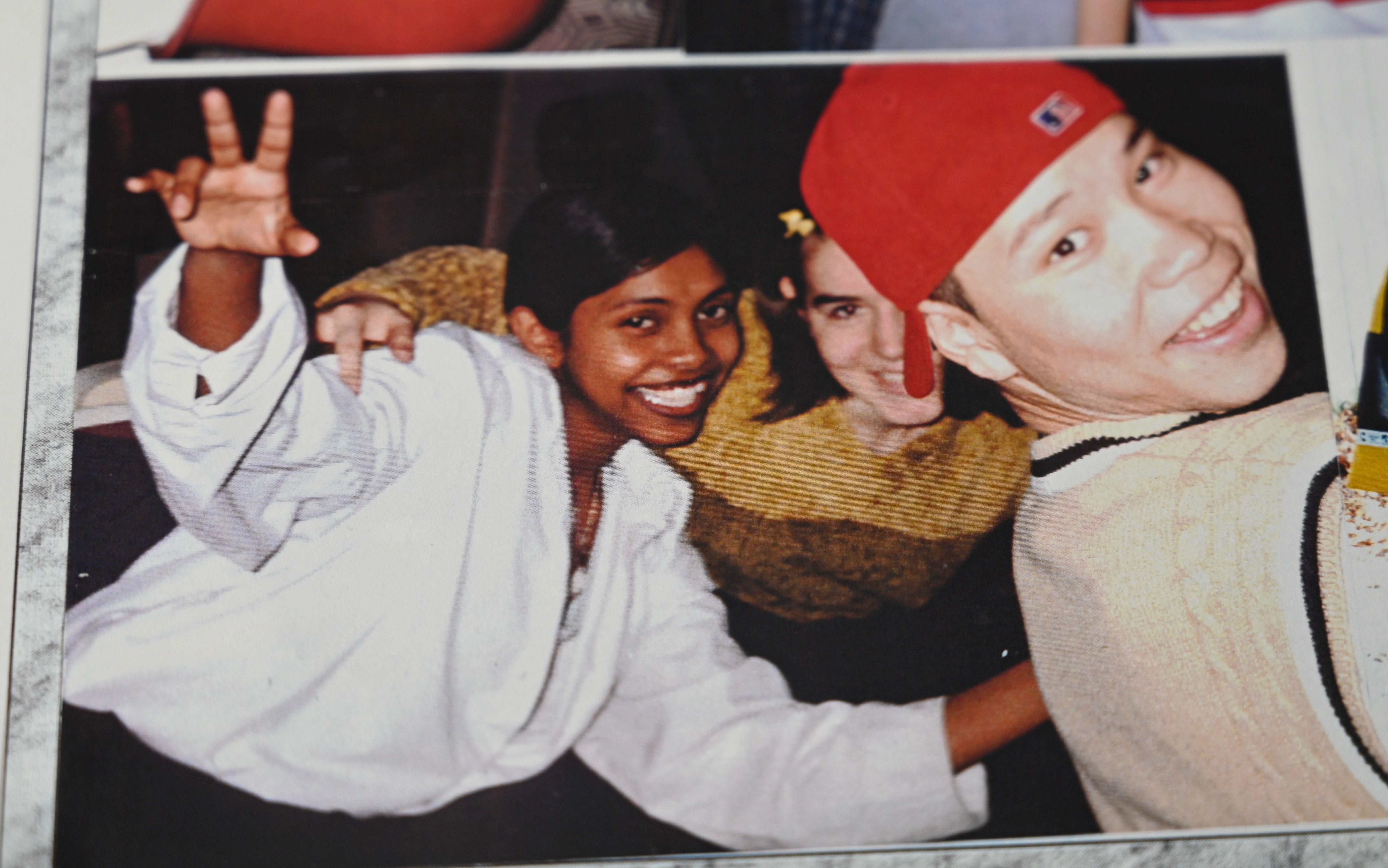 Sharmini, left, is shown with two friends in an image from her Grade 9 yearbook. (CBC)