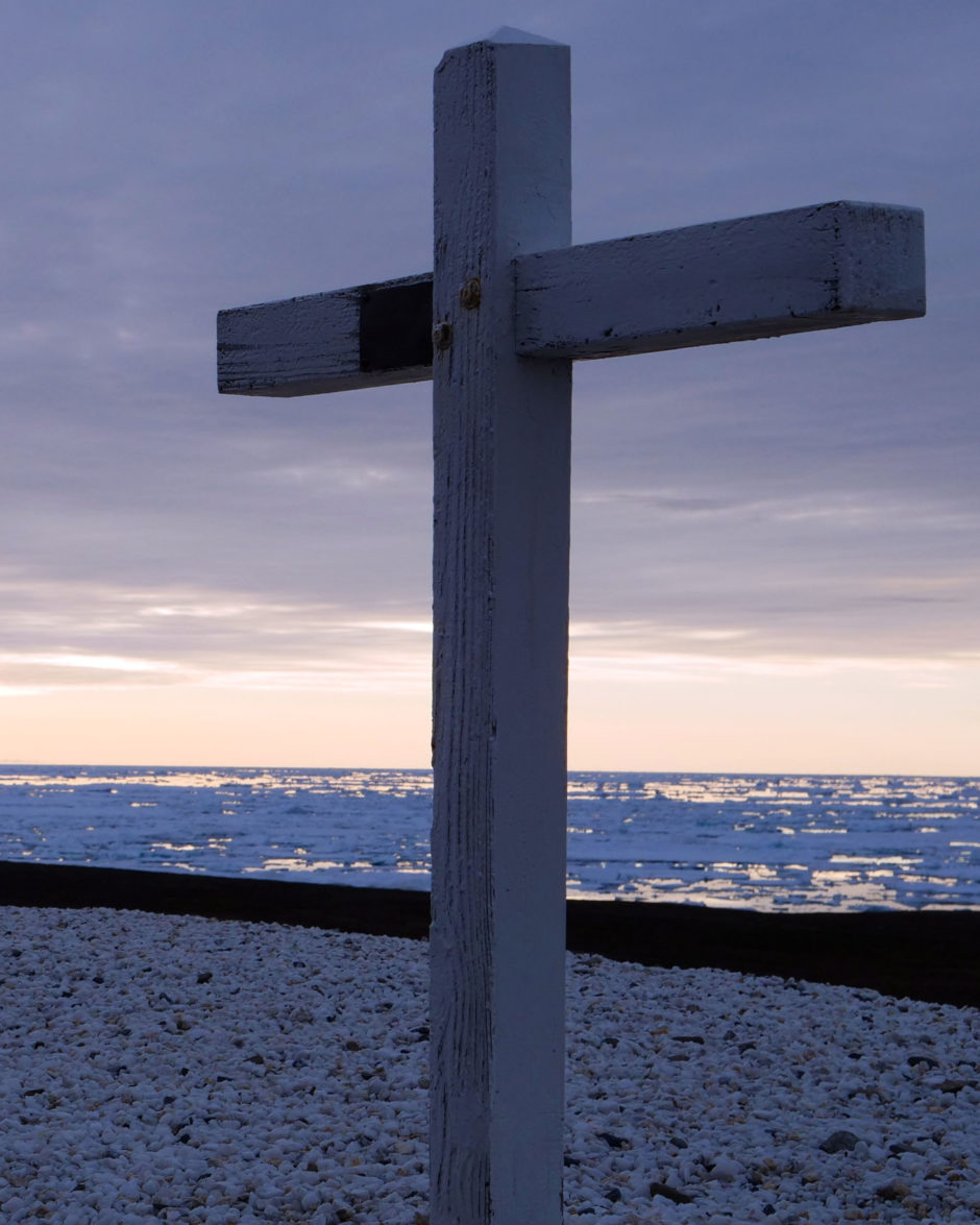 Wooden crosses on the Arctic coast mark the graves of nine people who died in a plane crash at a military base in Alert, Nunavut, in 1950.