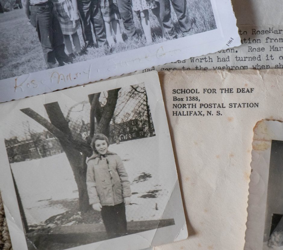 Two old photos of a little girl are shown with an envelop with the Halifax address of the School for the Deaf.