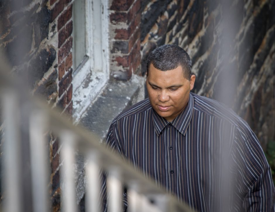 Yarnell Arsenault walks up the steps to Hope Cottage in Halifax.