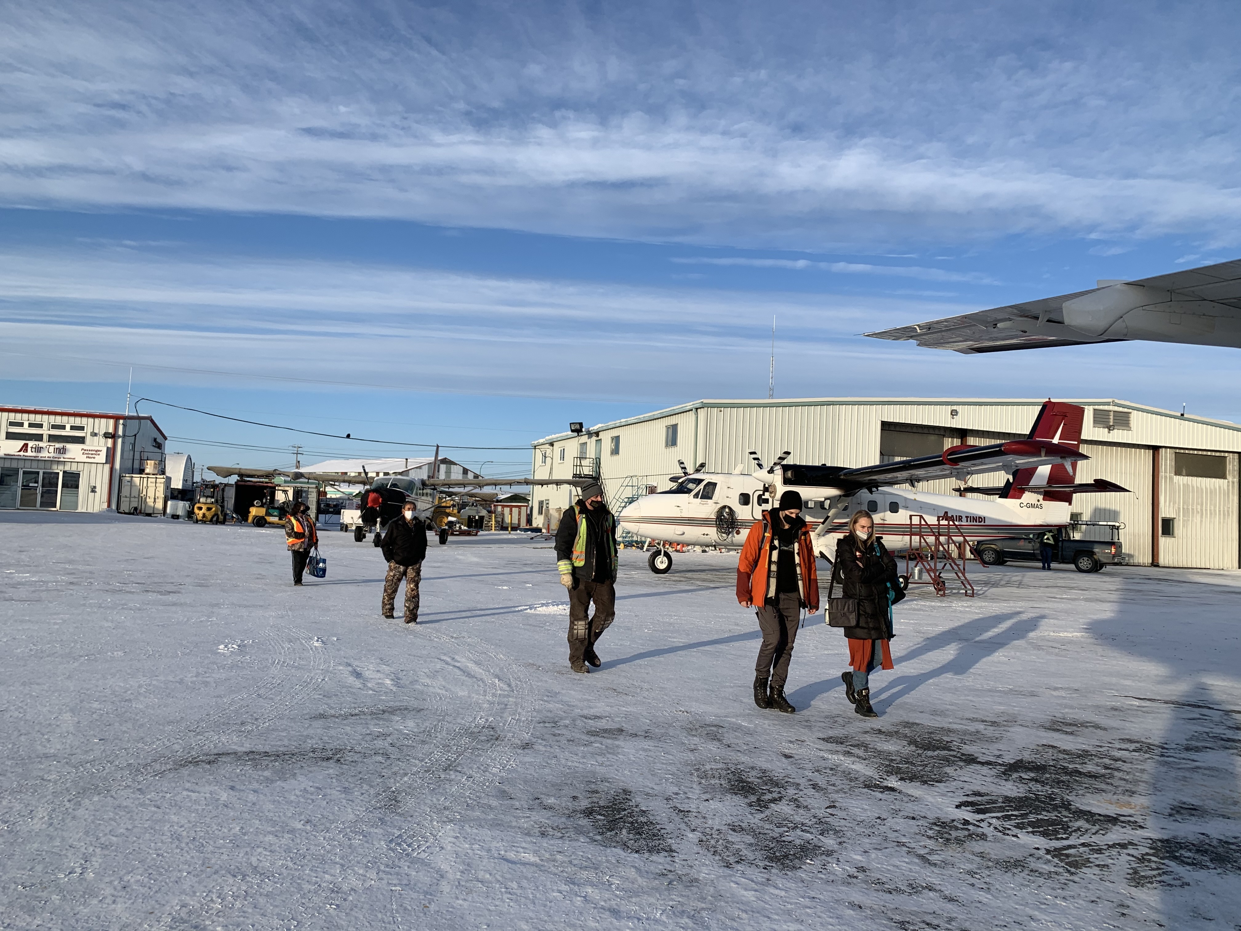 Passengers board a flight to Wekweètì and Gameti. (Sidney Cohen/CBC)