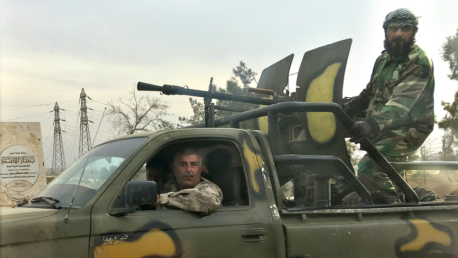 Pro-government fighters spotted along the road to Aleppo. (Margaret Evans/CBC)