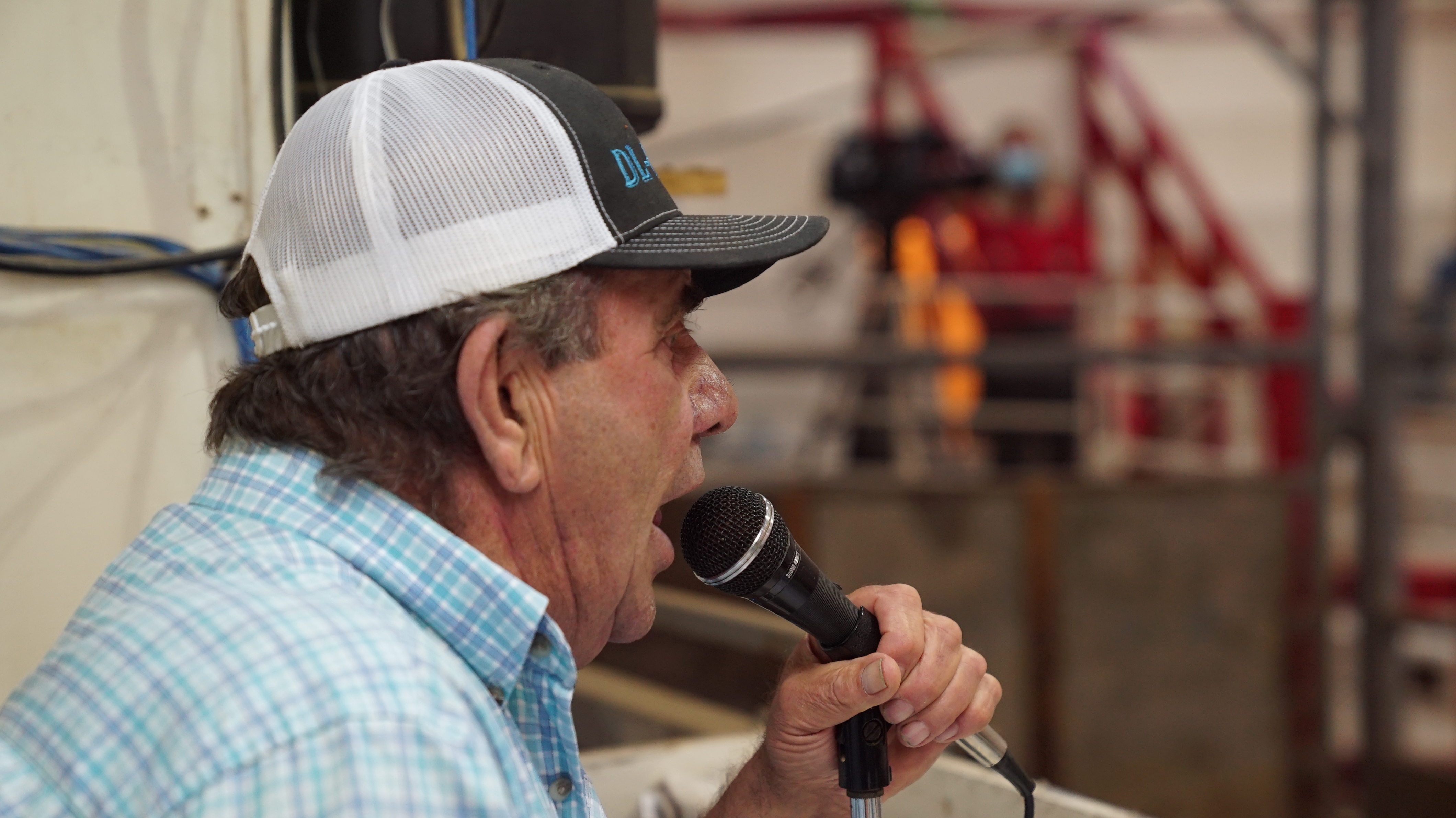 Lorne 'Buddy' Bergner has been an auctioneer at the Ashern Auction Mart for four decades. Holding sales this early in the season is unprecedented, he says, but producers have no choice. (Jaison Empson/CBC)