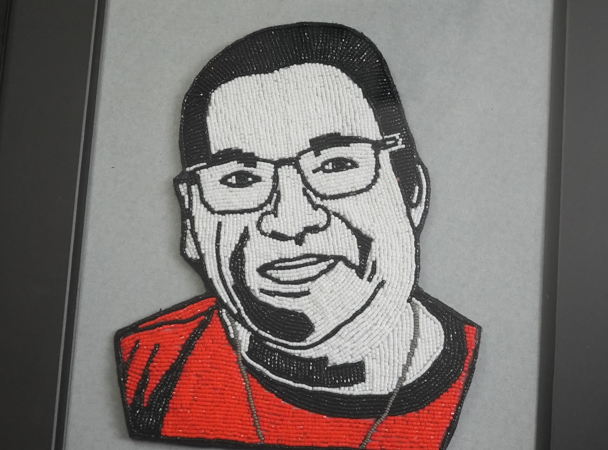 Ashley's beaded portrait of Patrick Augustine, a university instructor, story keeper and an elder from Elsipogtog First Nation. (Oscar Baker III/CBC)