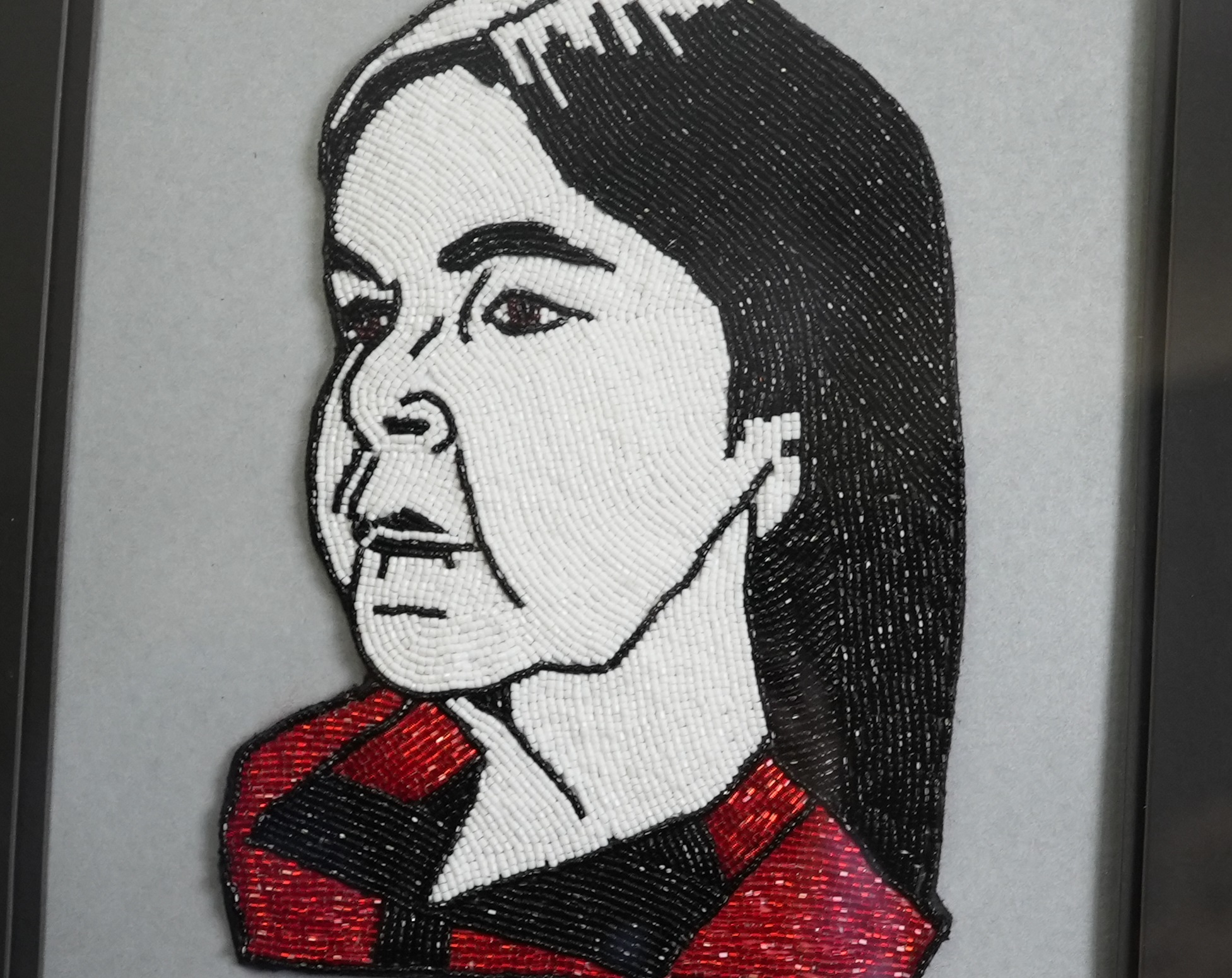 Ashley's beaded portrait of Donna Augustine, a sweat lodge keeper, a medicine keeper and a well respected elder from Elsipogtog First Nation. (Oscar Baker III/CBC)