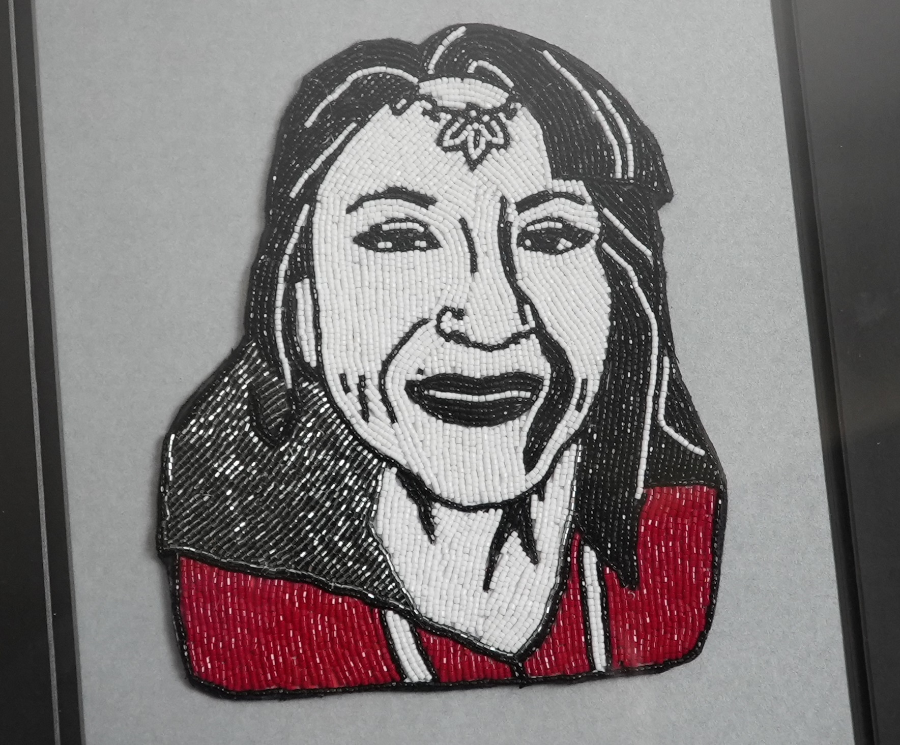 Ashley's beaded portrait of Andrea Simon, an advocate for missing and murdered Indigenous women and girls, a knowledge keeper and medicine keeper from Elsipogtog First Nation. (Oscar Baker III/CBC)