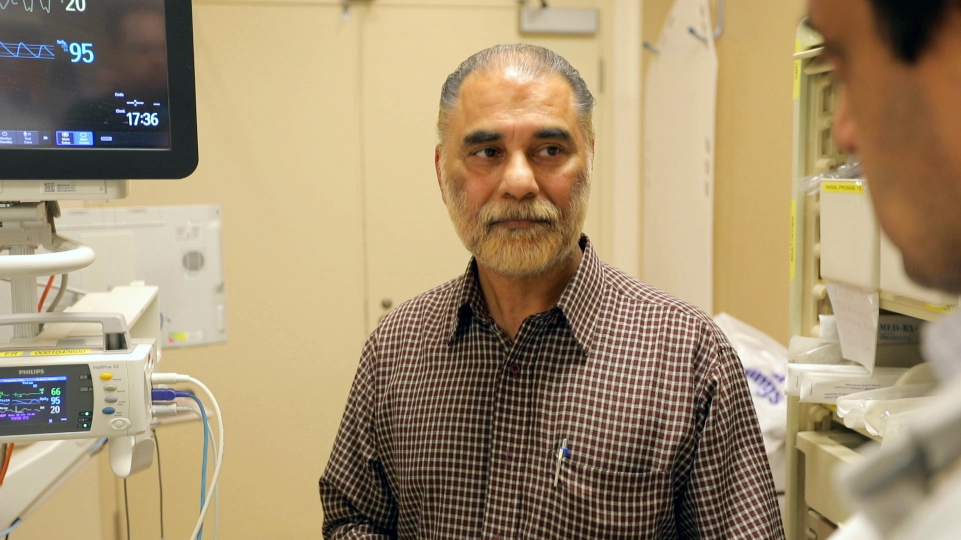 Surinder Singh Bharaj has been in the emergency room for more than 12 hours with his mother Surjit, who’s sleeping peacefully in her hospital bed. (Paul Borkwood/CBC News)