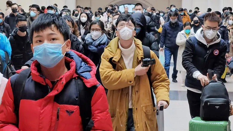 People wear face masks as they wait at Hankou Railway Station in Wuhan, China, in early January. (Xiaolu Chu/Getty Images)