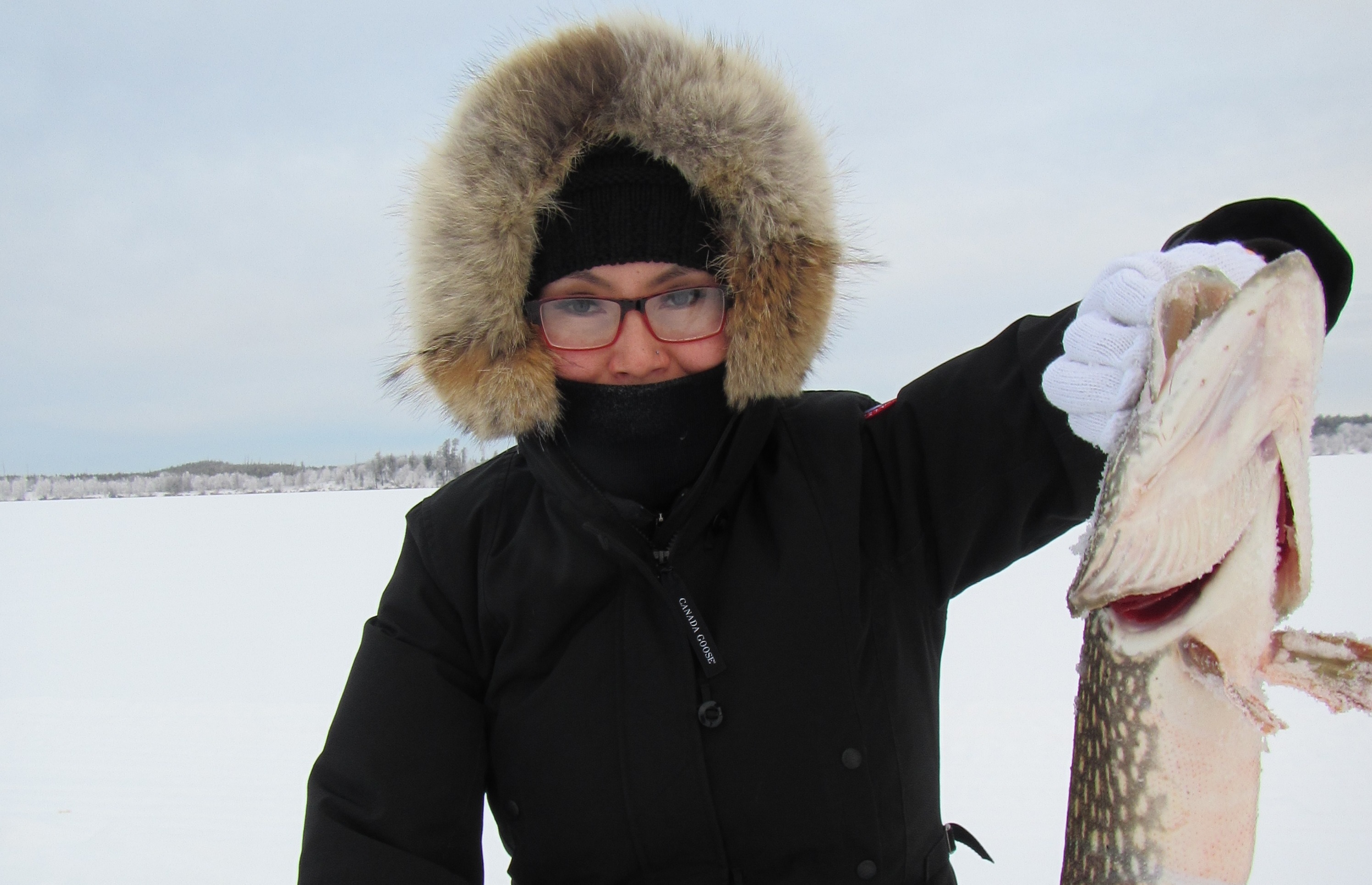 Cora Lemaigre catches a fish in a Dene culture class as part of her bachelor of education degree. (Submitted by Cora Lemaigre)