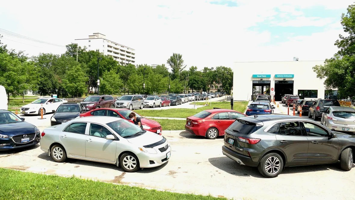 Long lines were a common site at drive-thru COVID-19 testing sites in Winnipeg in July. (Tyson Koschik/CBC)