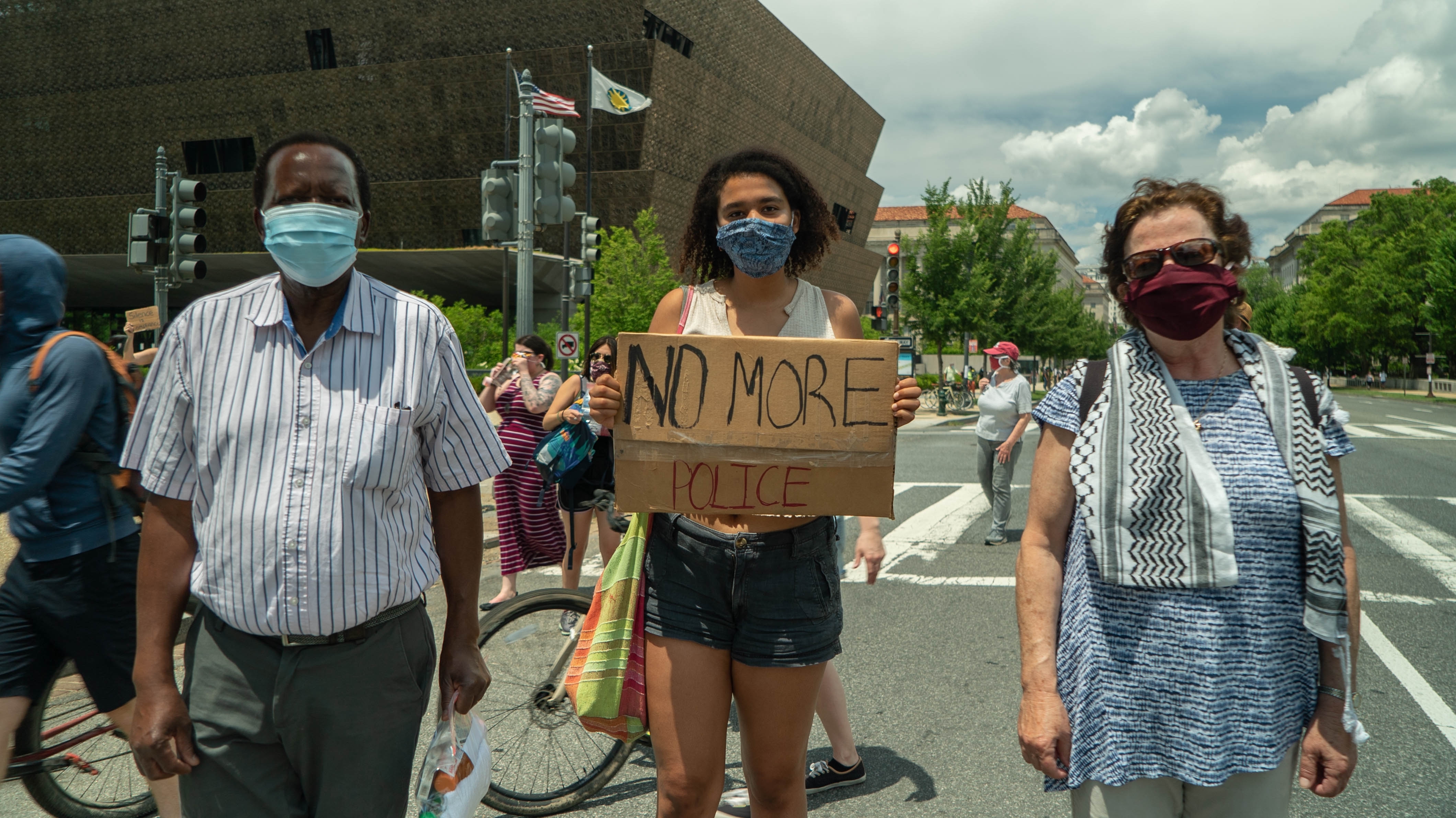 Handel Mlilo, his wife, Nadine Sahyoun and their daughter, Miranda, at the D.C. protest. (Jean-François Bisson/CBC)