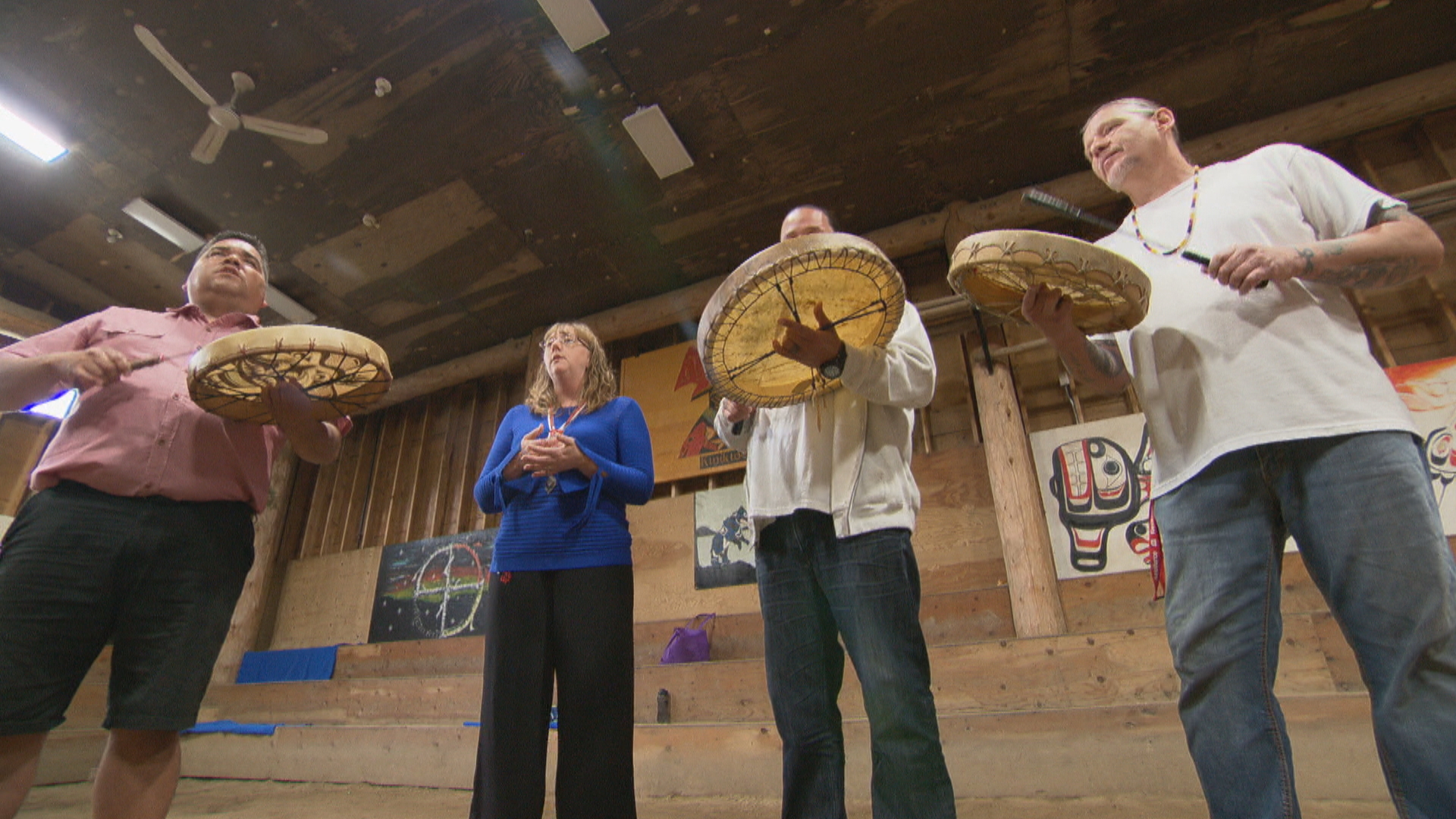 Debra Matties, the deputy warden of Kwìkwèxwelh, stands with inmates before a ceremony to honour the release of two men. (Angela Sterritt/CBC)