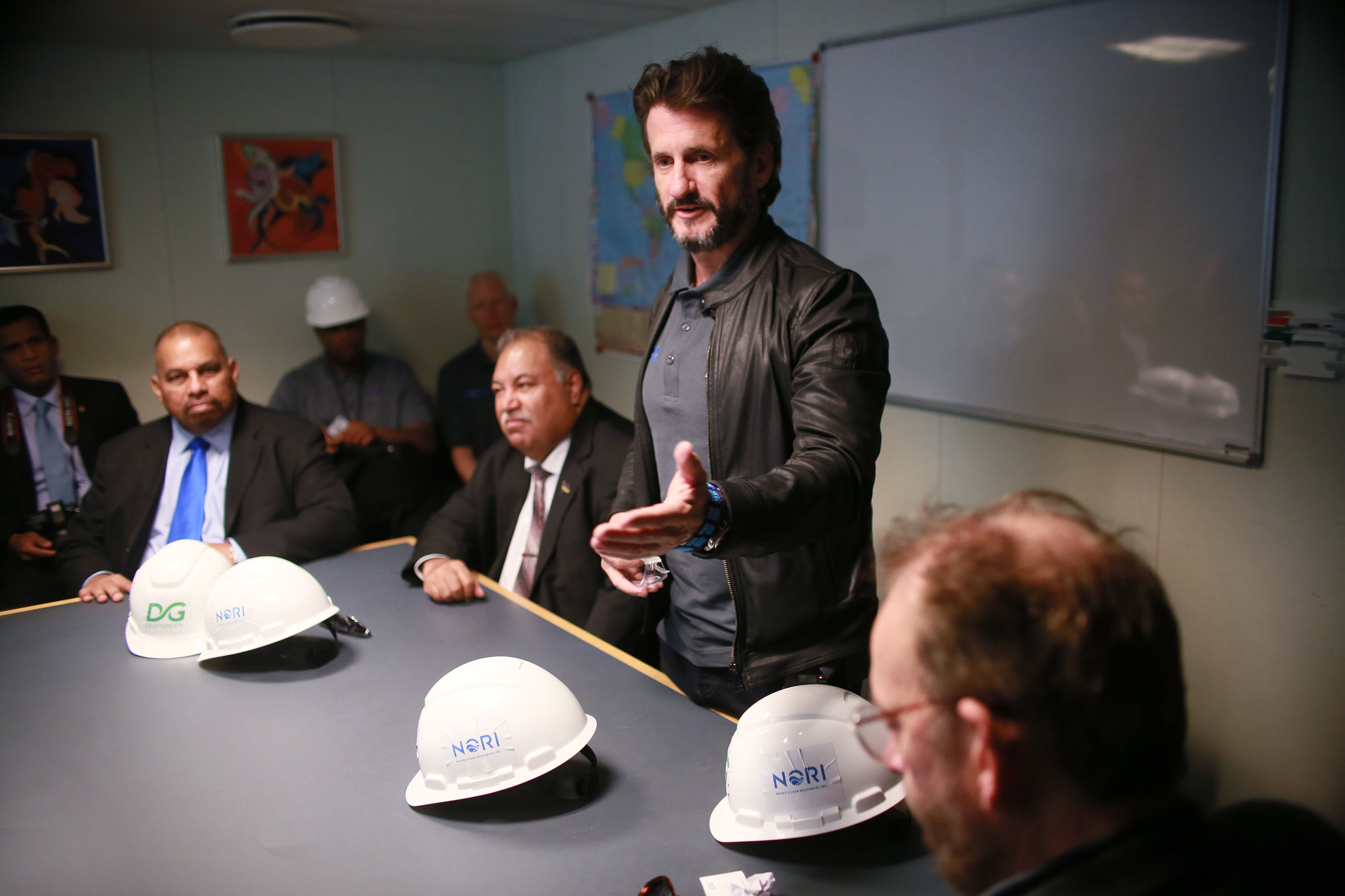 DeepGreen CEO Gerard Barron, standing, speaks to Nauru President Baron Waqa, to his immediate right, and others in Nauru in April 2018. DeepGreen has a partnership with the small Pacific country that enables the company to hunt for manganese nodules in the Clarion-Clipperton Fracture Zone. (Sandy Huffaker/Associated Press)