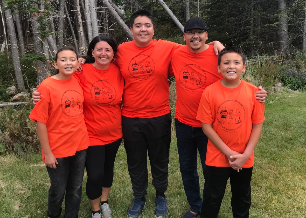 Dakoda Dicker, left, drew the design for this year's Orange Shirt Day for a contest with First Light. She and her family moved from Nain to Portugal Cove-St. Philip's in 2018. (Submitted by Lori Dicker)