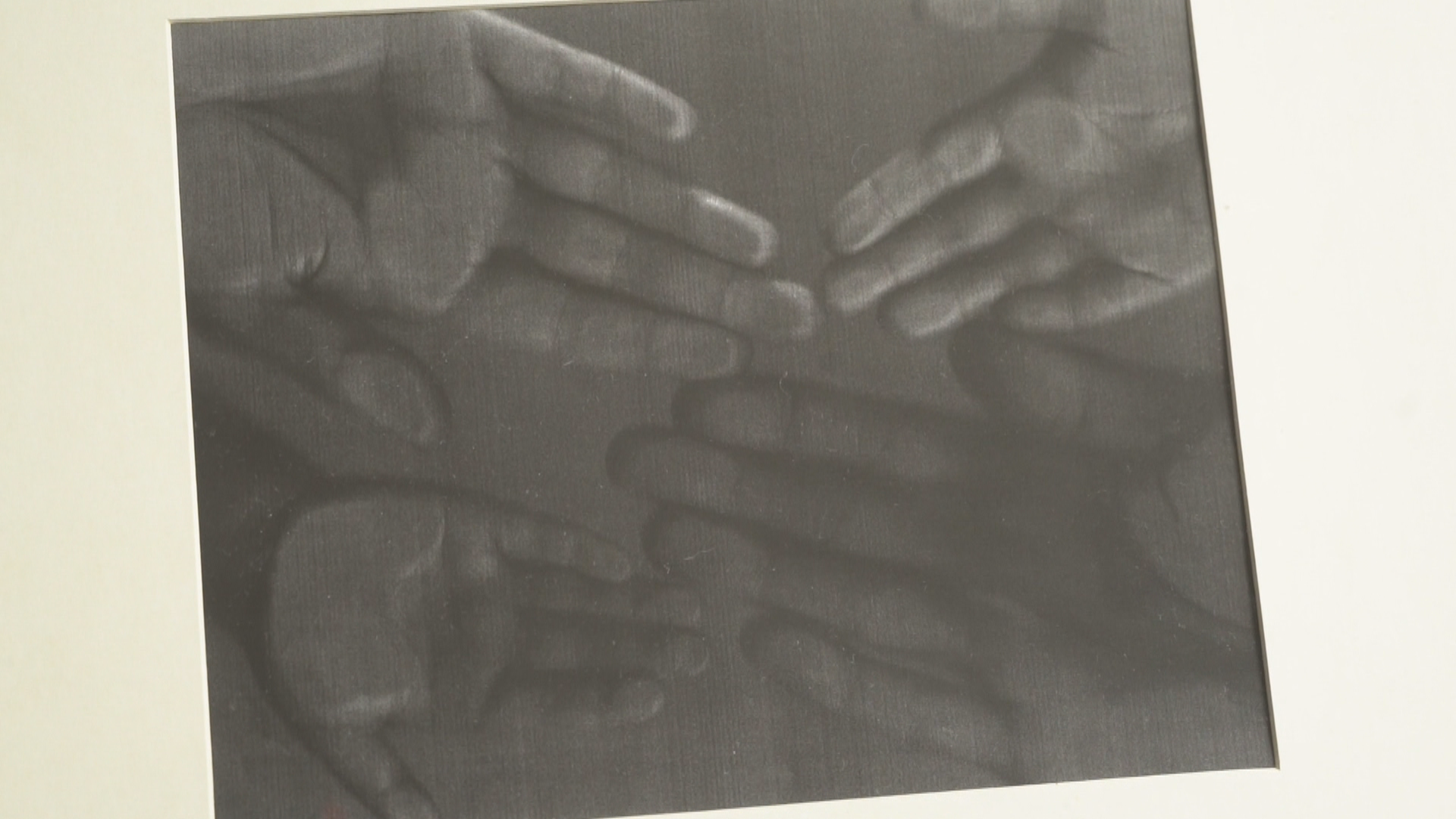 A photocopy of the family's hand prints hangs in their hallway. (Gary Quigley/CBC)