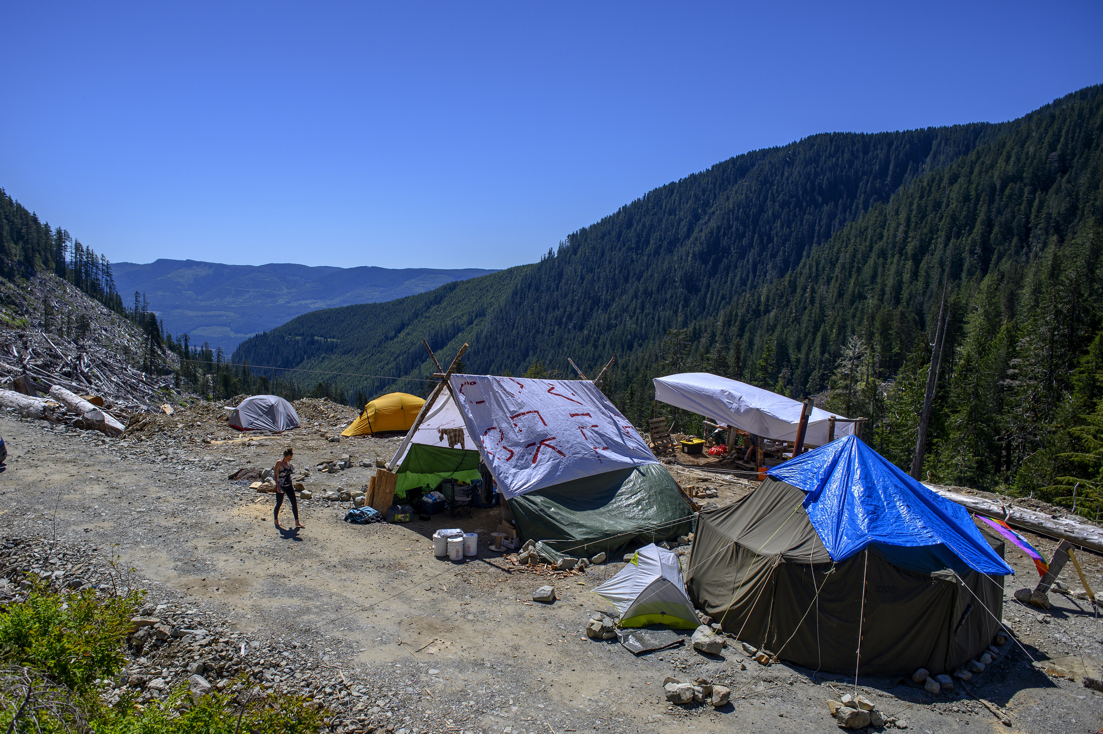 Activists have set up a series of camps in the hills near the Fairy Creek watershed that they use to help delay police and industry from reaching the unlogged territory. This one is called Heli Camp. (Kieran Oudshoorn/CBC)