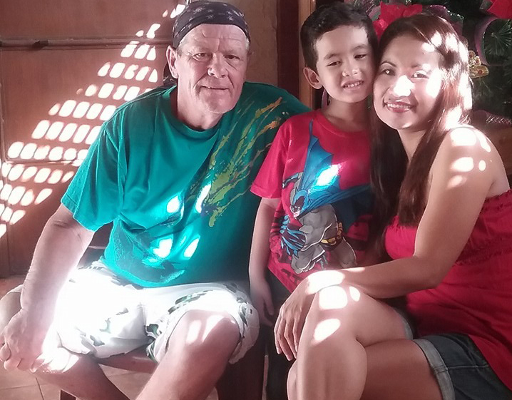 Luzie and Barry Gammon and their son, JJ, at their home in the Philippines. (Luzie Gammon) 