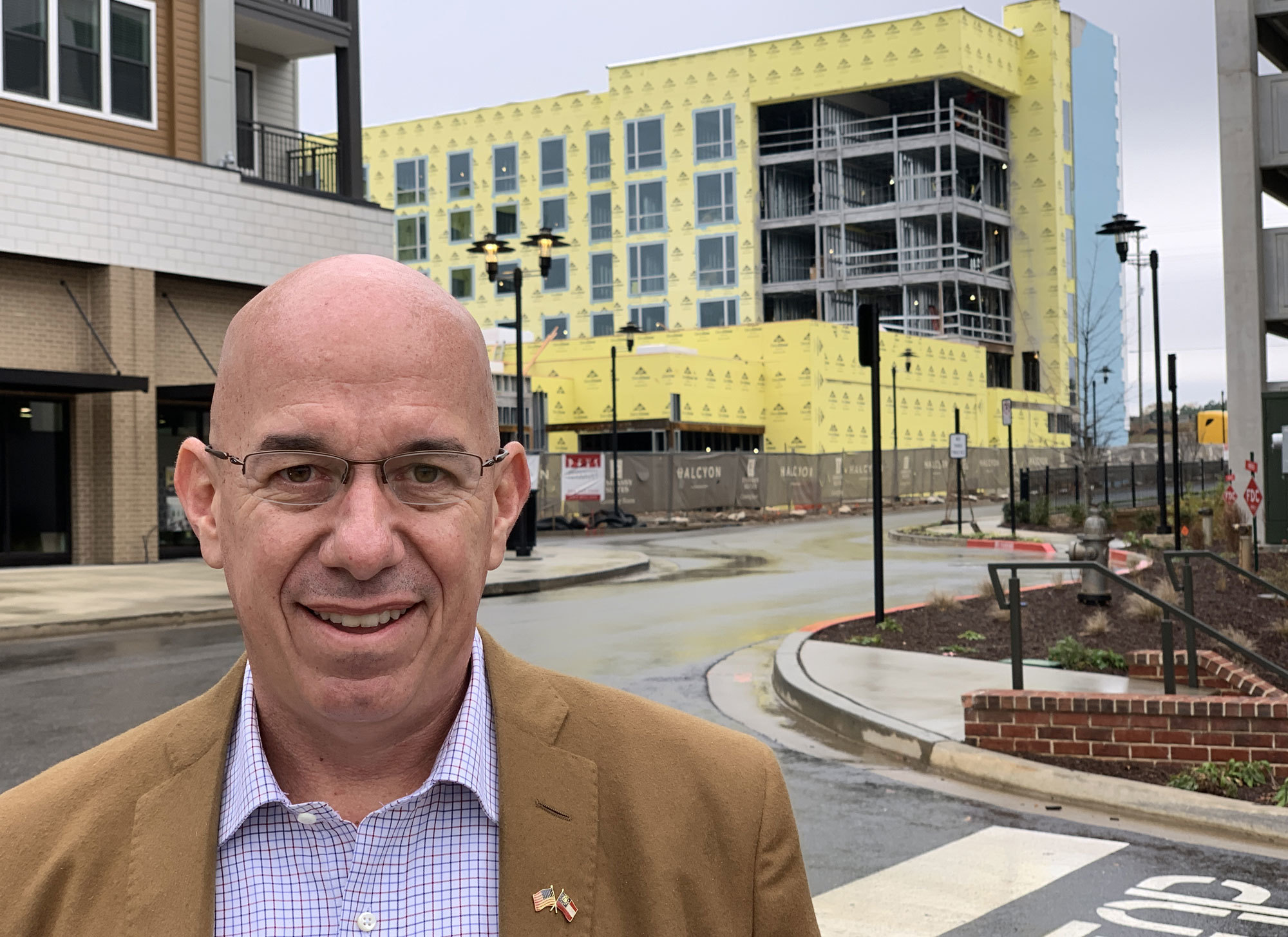 Carter Patterson, seen in one of Forsyth’s new construction developments, says the region’s new diversity is a great asset. (Alexander Panetta/CBC)