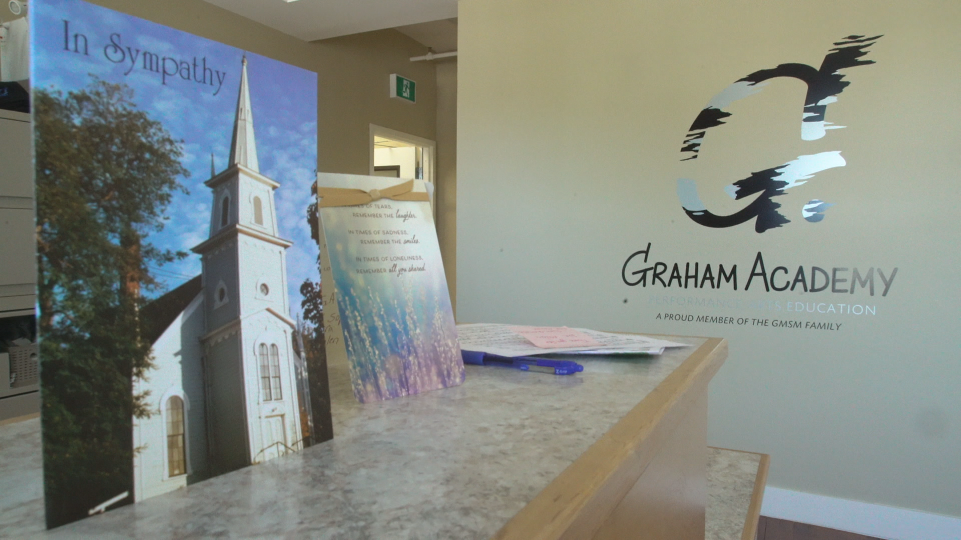 Sympathy cards were placed on the front desk in the lobby of the Graham Academy. (Jen White/CBC)