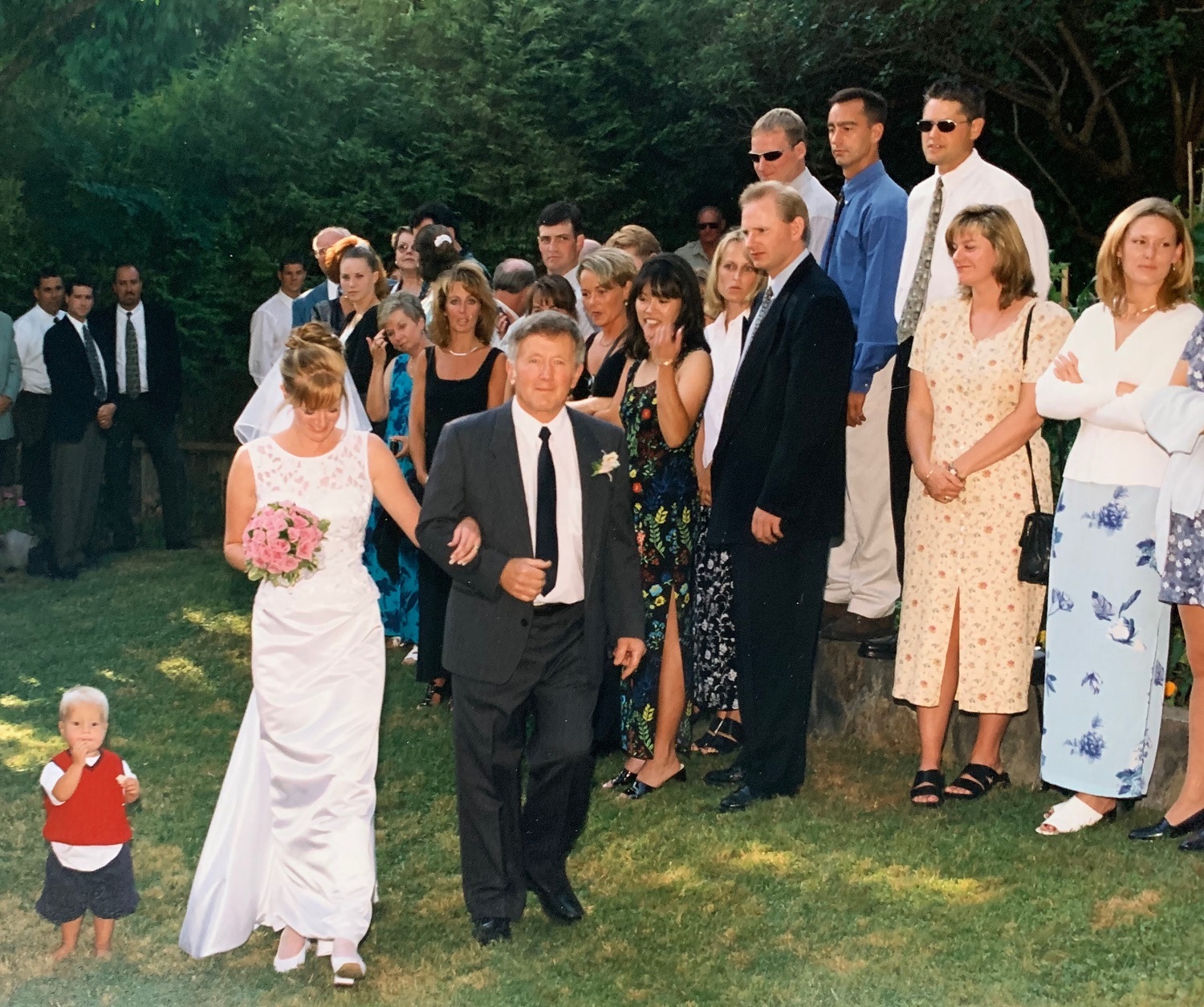 Megan Frederick walks down the aisle arm-in-arm with her father, Michael Smith, on her wedding day. (Submitted by family)