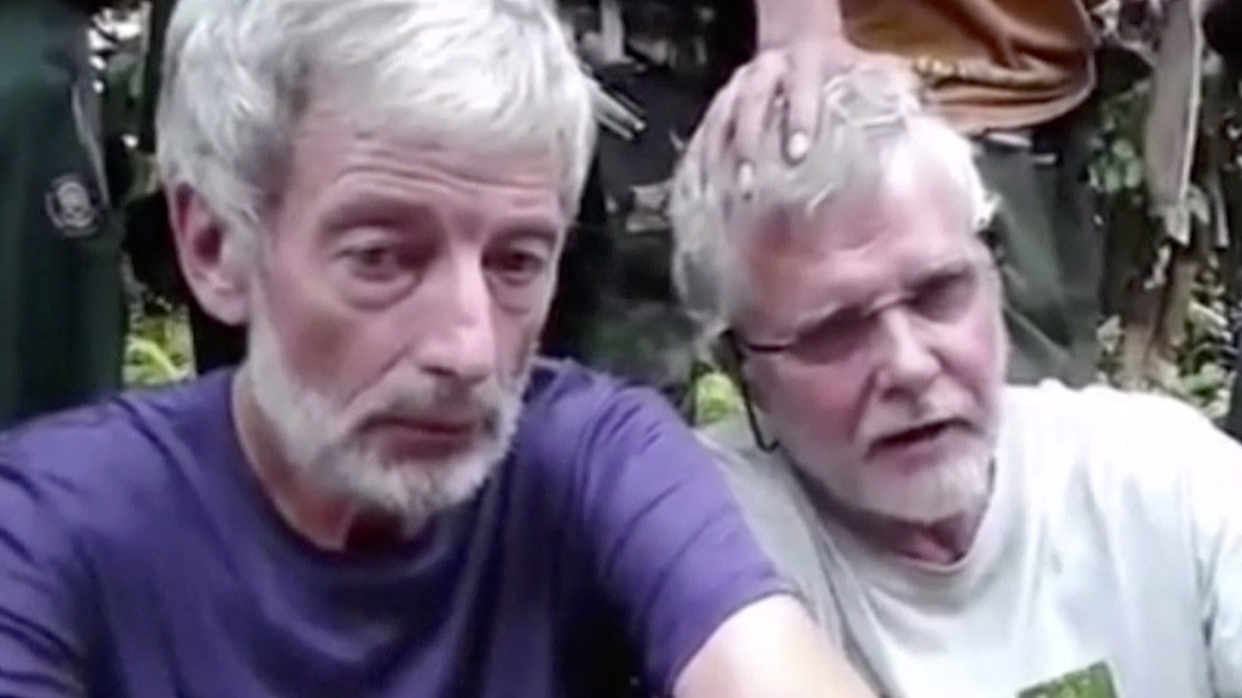 Hall, left, and Ridsdel as they appeared in a video released by fighters with Abu Sayyaf. (Canadian Press)