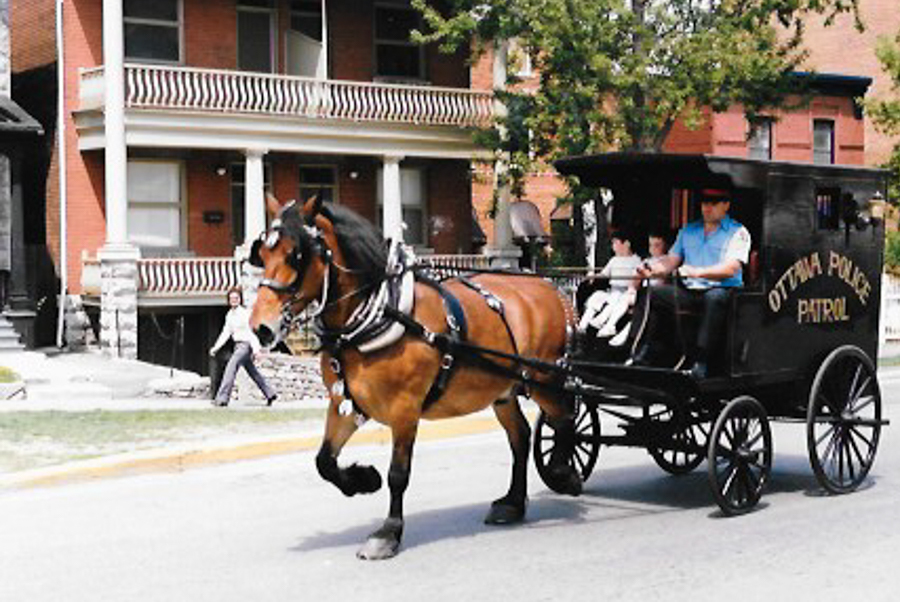 The Cundell family loaned horses to the police. John Cundell is pictured here riding with his kids after the horse patrol was retired. (Submitted by Cundell family)