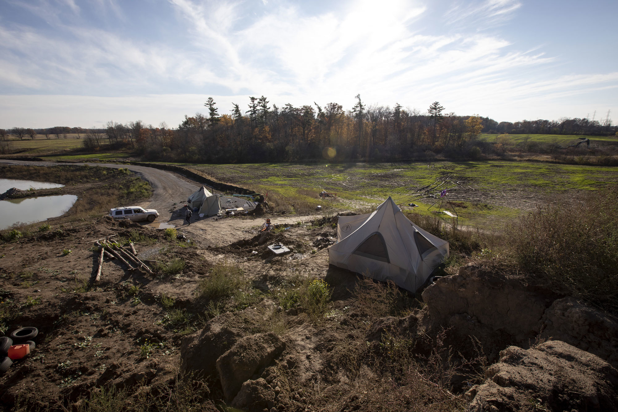 A view of some of the tents that form the 1492 Land Back Lane camp on the planned McKenzie Meadows subdivision. (Evan Mitsui/CBC)