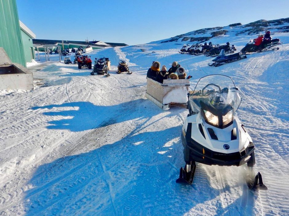 Snowmobiles and komatiks outside the Amos Comenius School in Hopedale, Labrador. (Kellie Walsh)