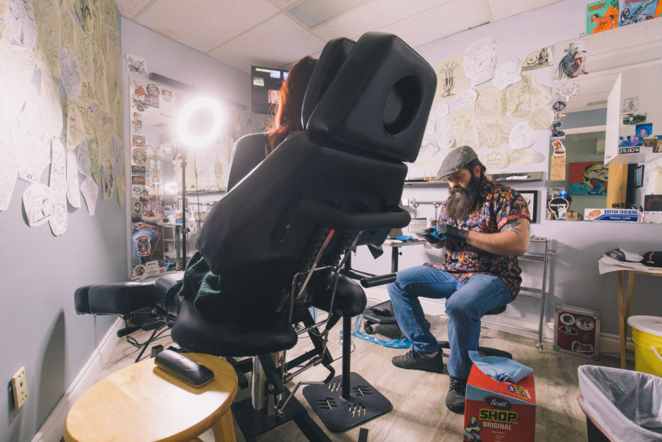 Chris Rhyason works on a tattoo in his Grande Prairie tattoo studio.