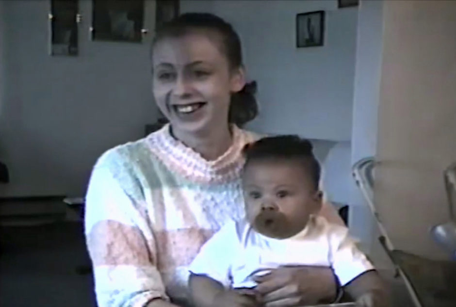 Daniel Benoit sits on his mother's knee in his former family home. (Submitted by Daniel Benoit)