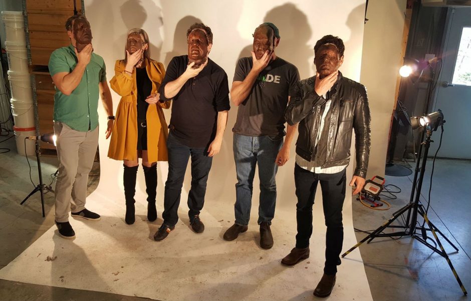 Jeremy Eaton, Krissy Holmes, Mark Critch, Todd Perrin and Allan Hawco hold masks of their faces. (Ian Gillies) 