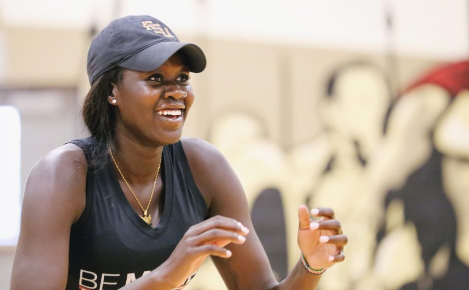 A smiling Adut Bulgak on the basketball court