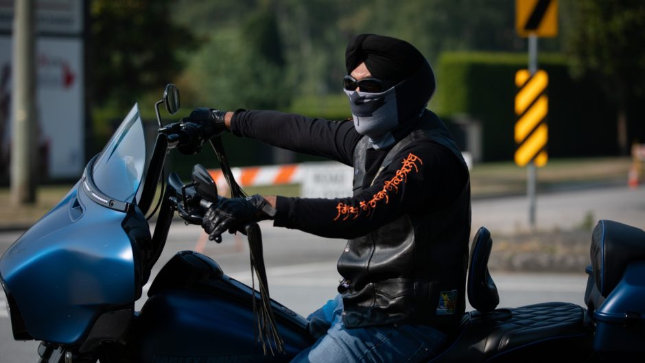 A man rides a motorcycle as part of the 9/11 Memorial Ride to the Peace Arch border crossing in B.C.