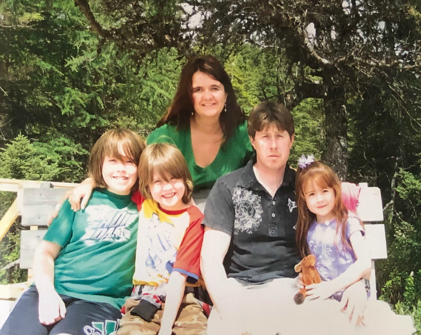 A family photo of April, Chris, and their three children. (Jen White/CBC)