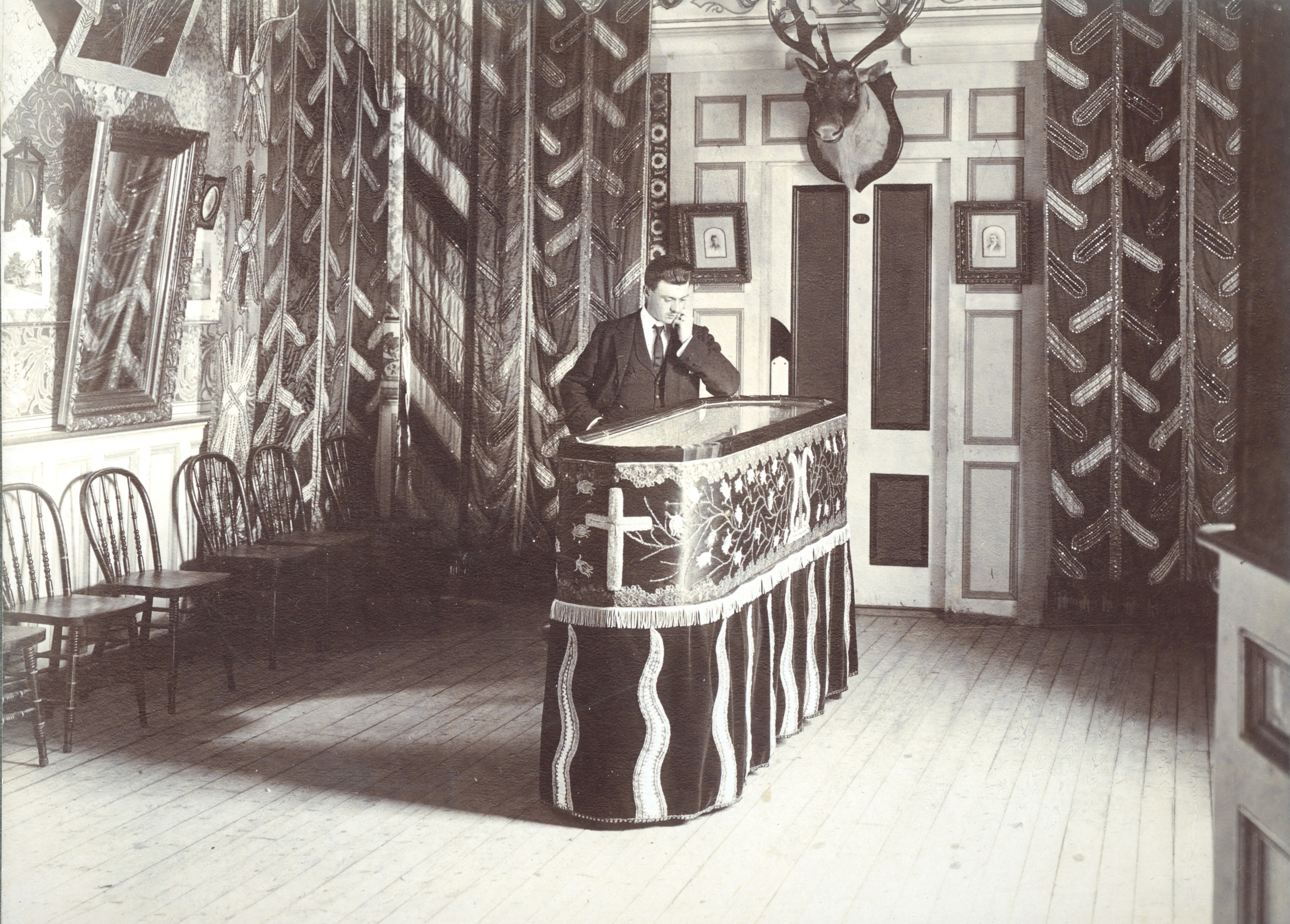 Charles Danielle's coffin with a glass top, on display inside his Octagon Castle in the 1890s. (MUN Archives)