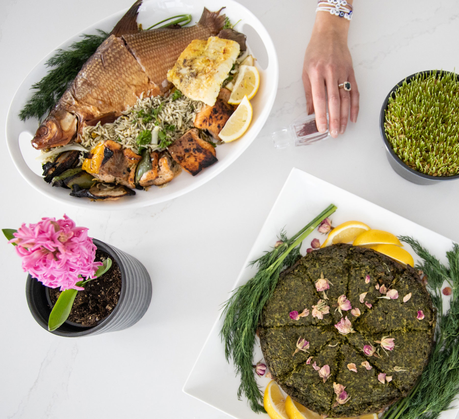 Kookoo sabzi, a herbed frittata, and sabzi polo ba mahi, herbed rice with fish, are two of the dishes served at Nowruz. (Tina Lovgreen/CBC)