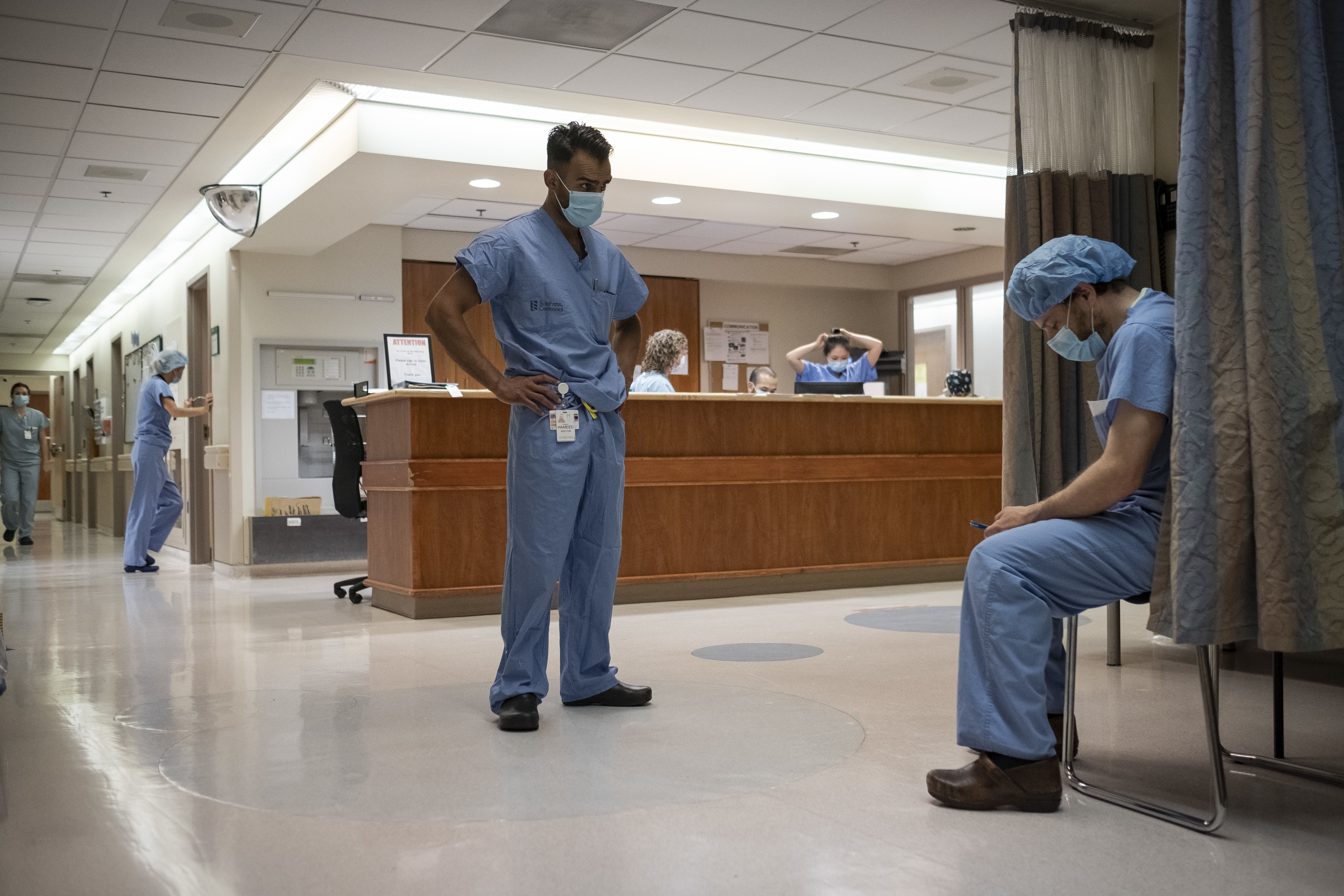 Surgical oncologists Dr. Usmaan Hameed, left, and Dr. Peter Stotland, inside and outside the OR. (Evan Mitsui/CBC)