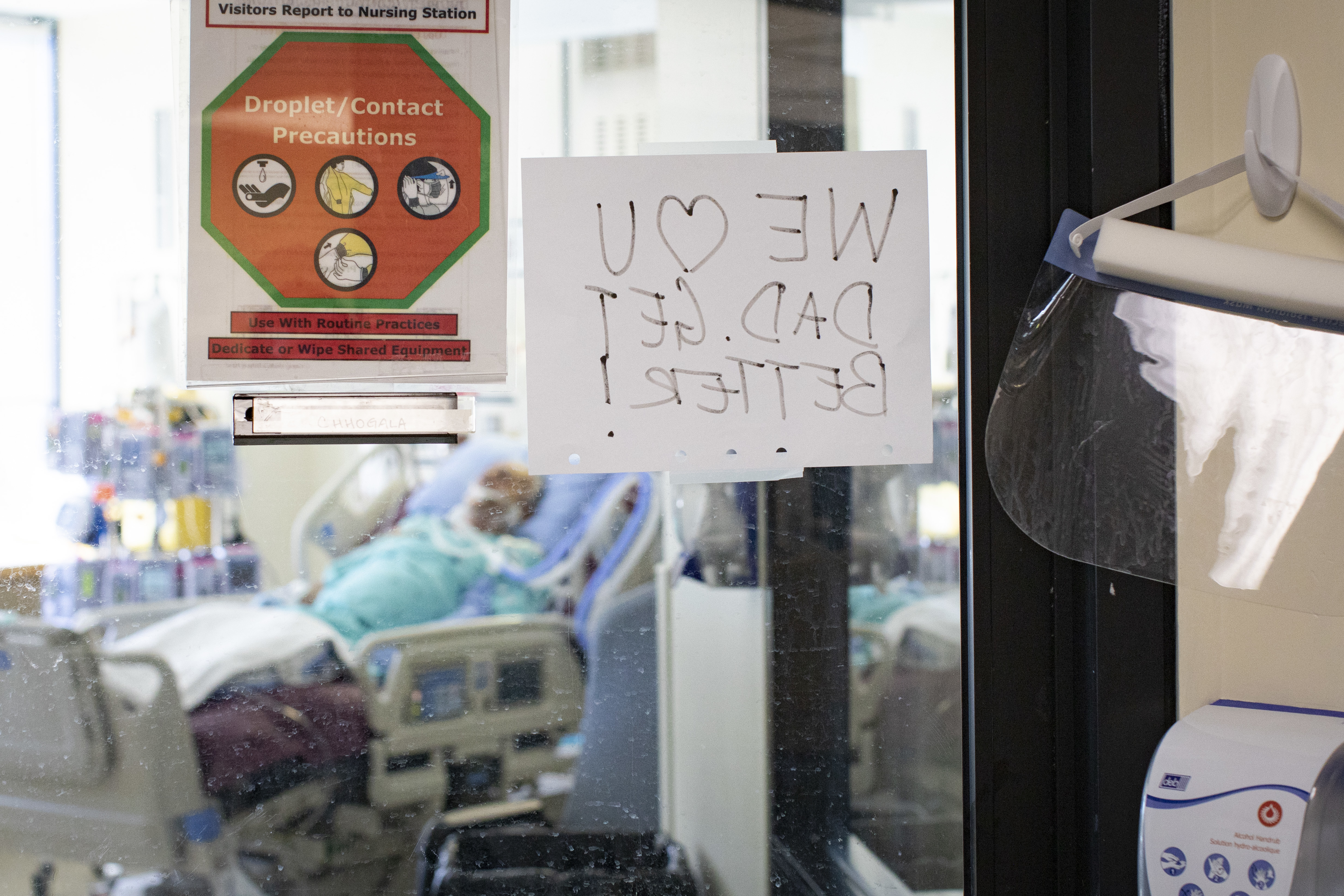 A sign on the window of a patient's room left by family members. One of the more agonizing aspects of the pandemic has been the inability of family to visit their loved ones when they are at their most vulnerable. (Evan Mitsui/CBC)