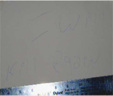 A message scrawled on the wall in Carr's house reads 'I will kill again. (Submitted by Charlottetown Police)